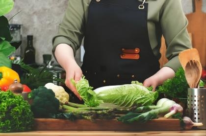 stock-photo-private-chef-carefully-chops-fresh-vegetables-on-cutting-board-preparing-healthy-dishes-from-2687275399(1).jpg