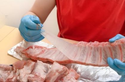 stock-photo-removing-the-membrane-from-the-bone-into-strips-of-pork-ribs-traditional-roast-pork-raw-pork-ribs-2546890077(1).jpg